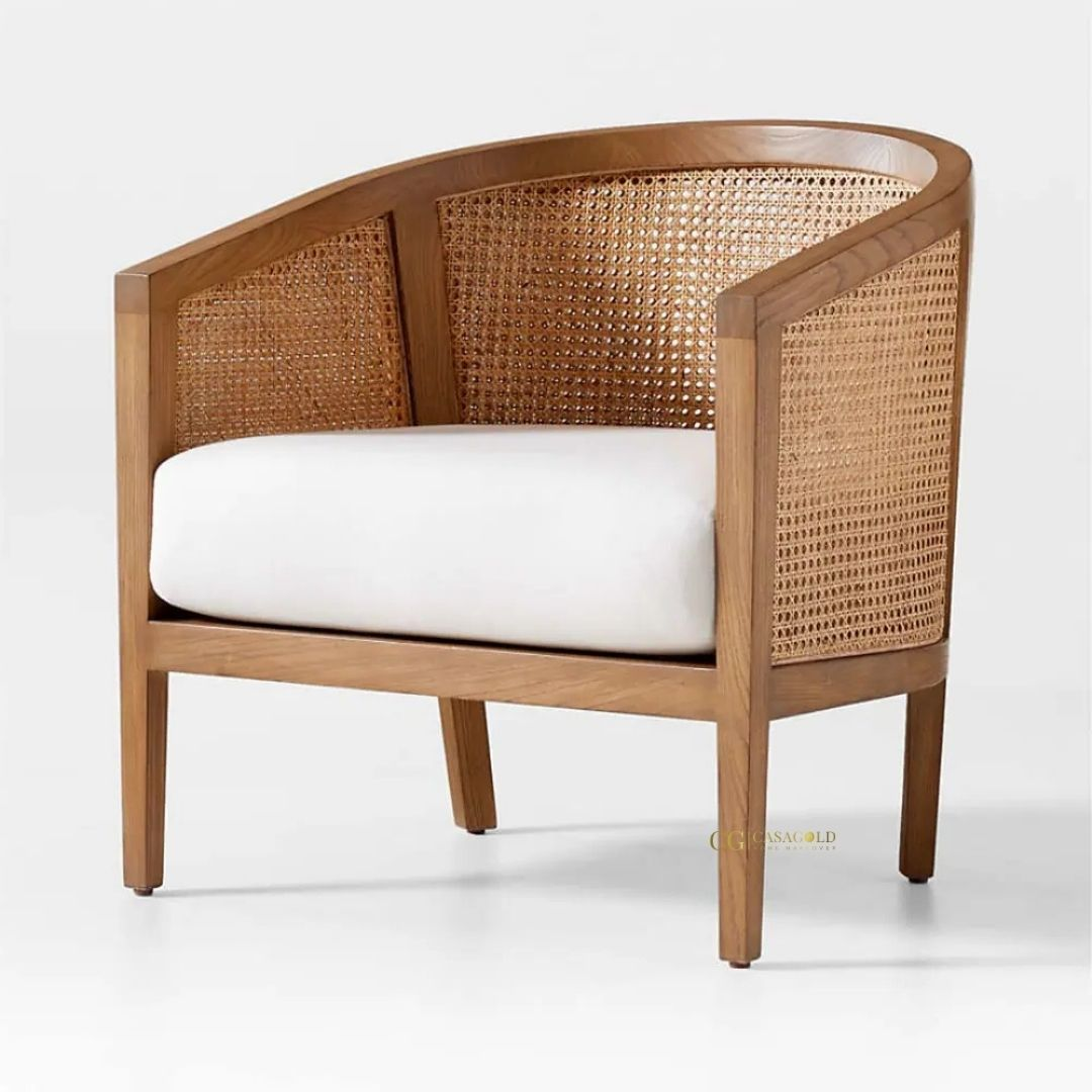 Handcrafted rattan armchair with intricate wicker weaving, perfect for indoor and outdoor spaces.