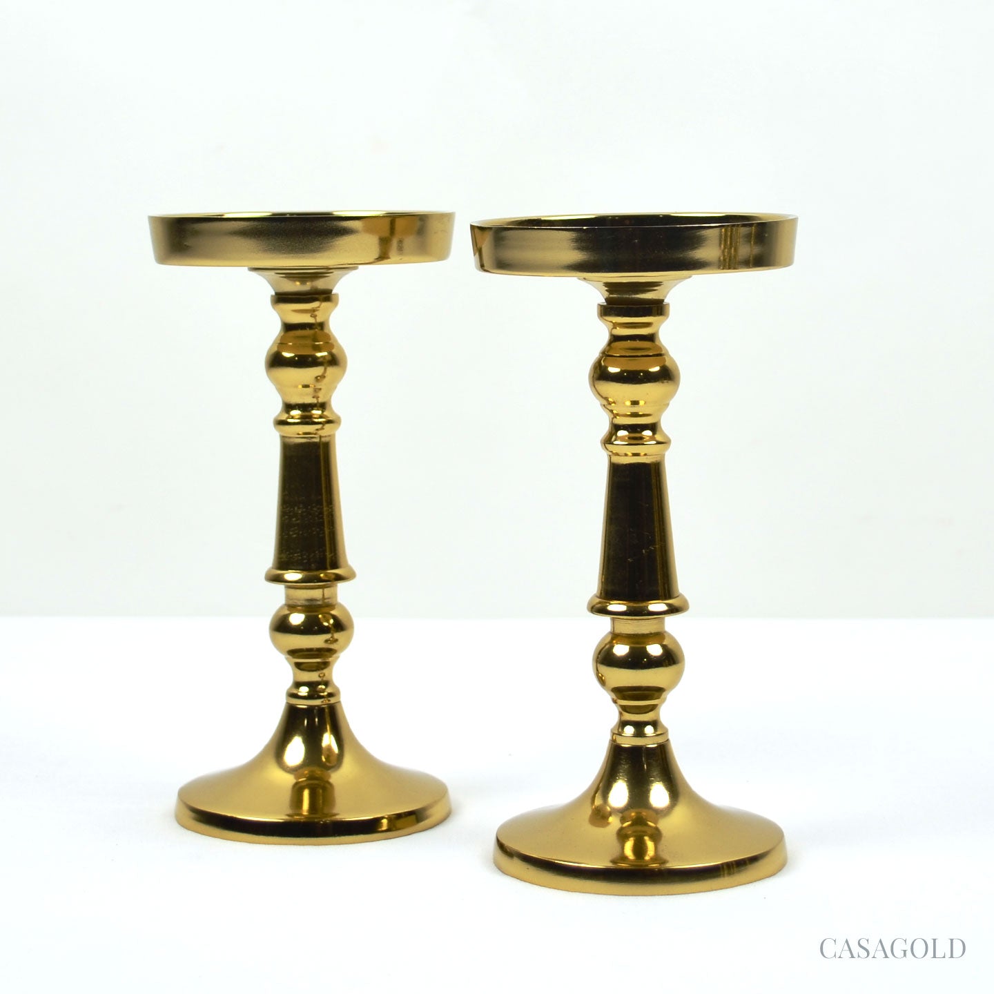 Brass candle holder on a dining table