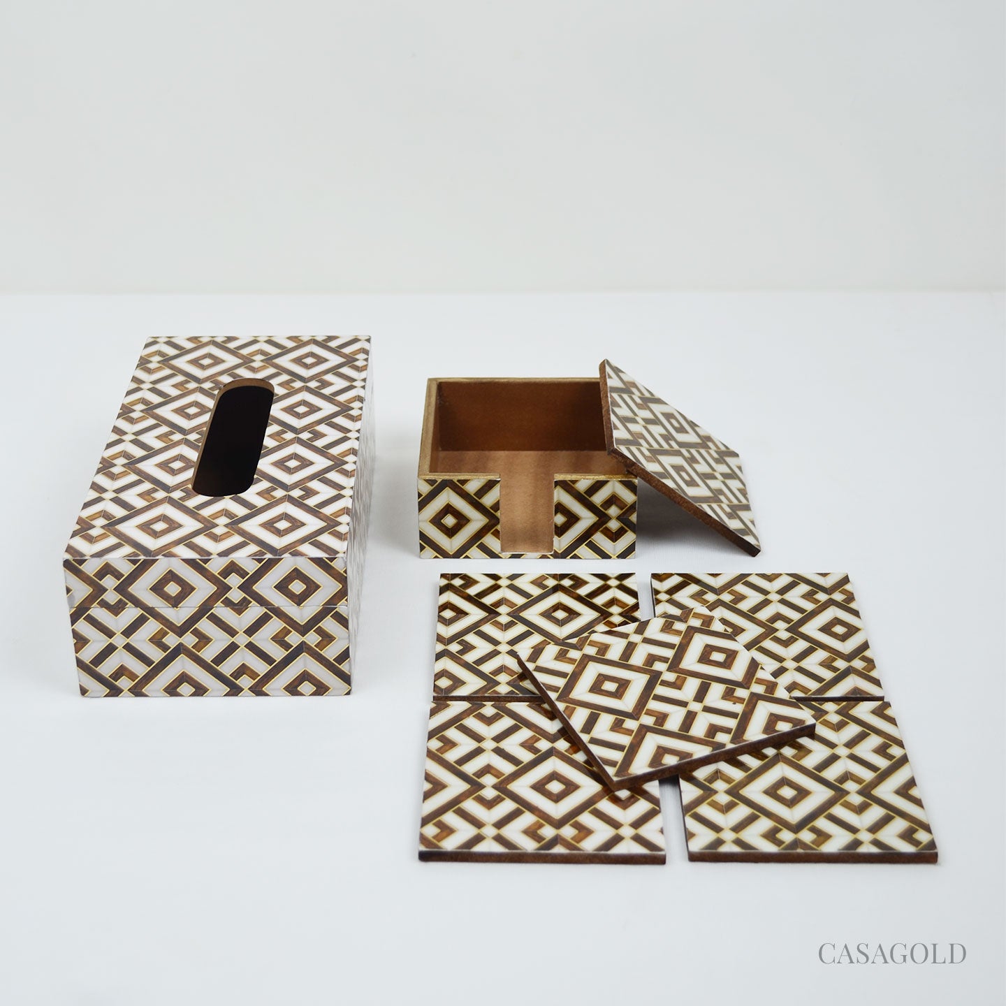 Coaster set with a gold-accented tissue box
