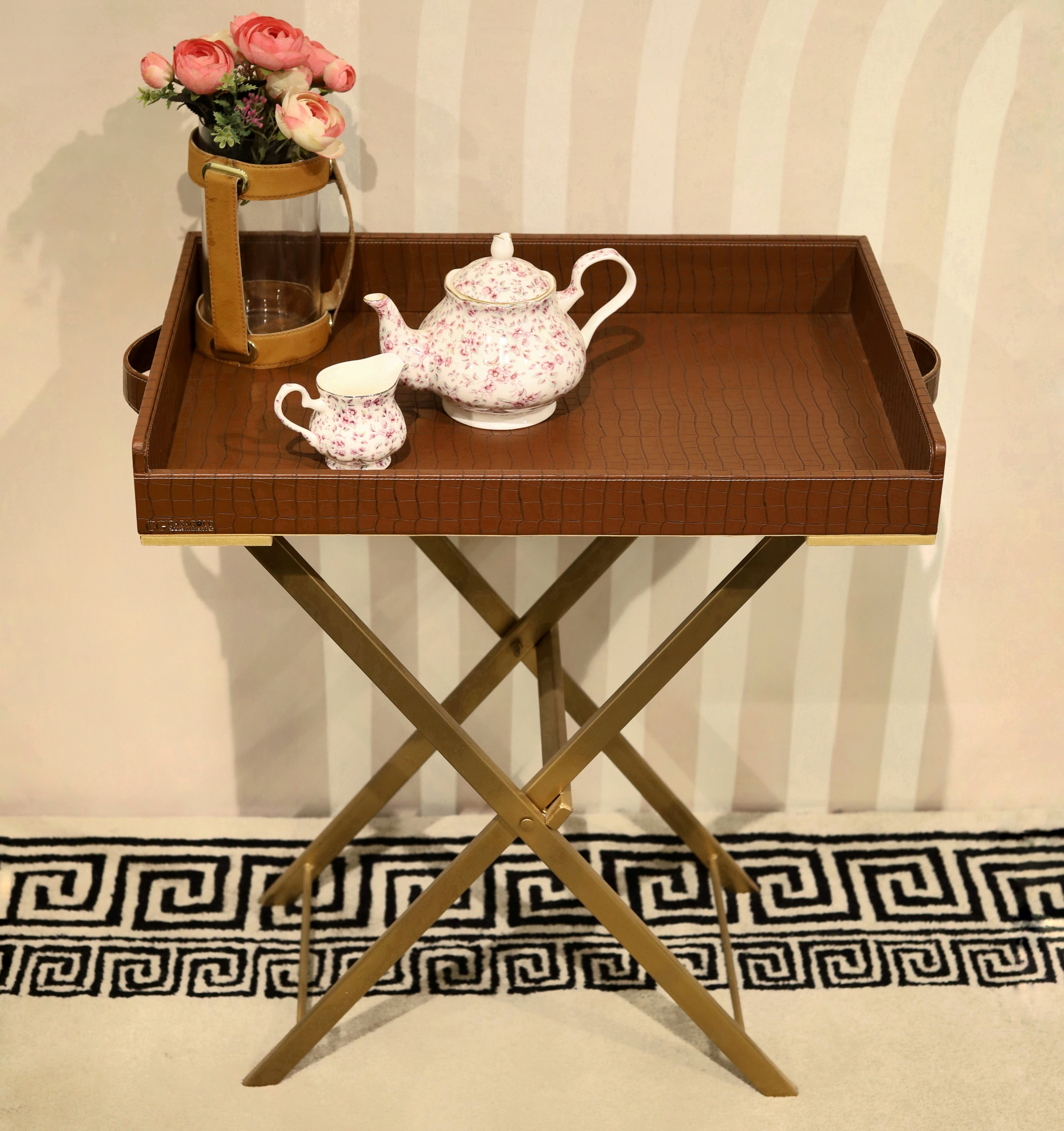 Brown leather tray with golden handles