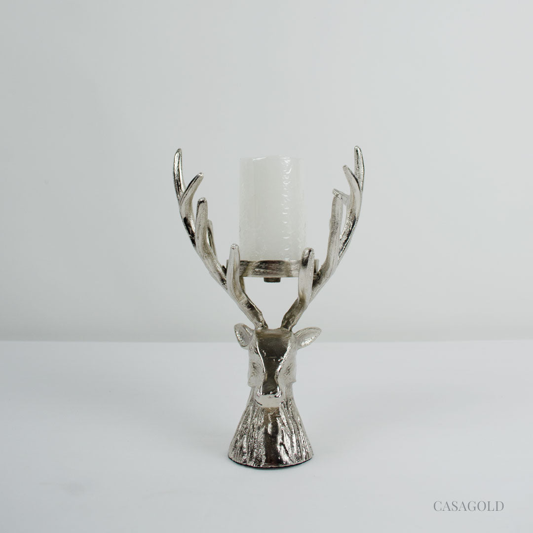 Classic Stag scroll design brass holder on table