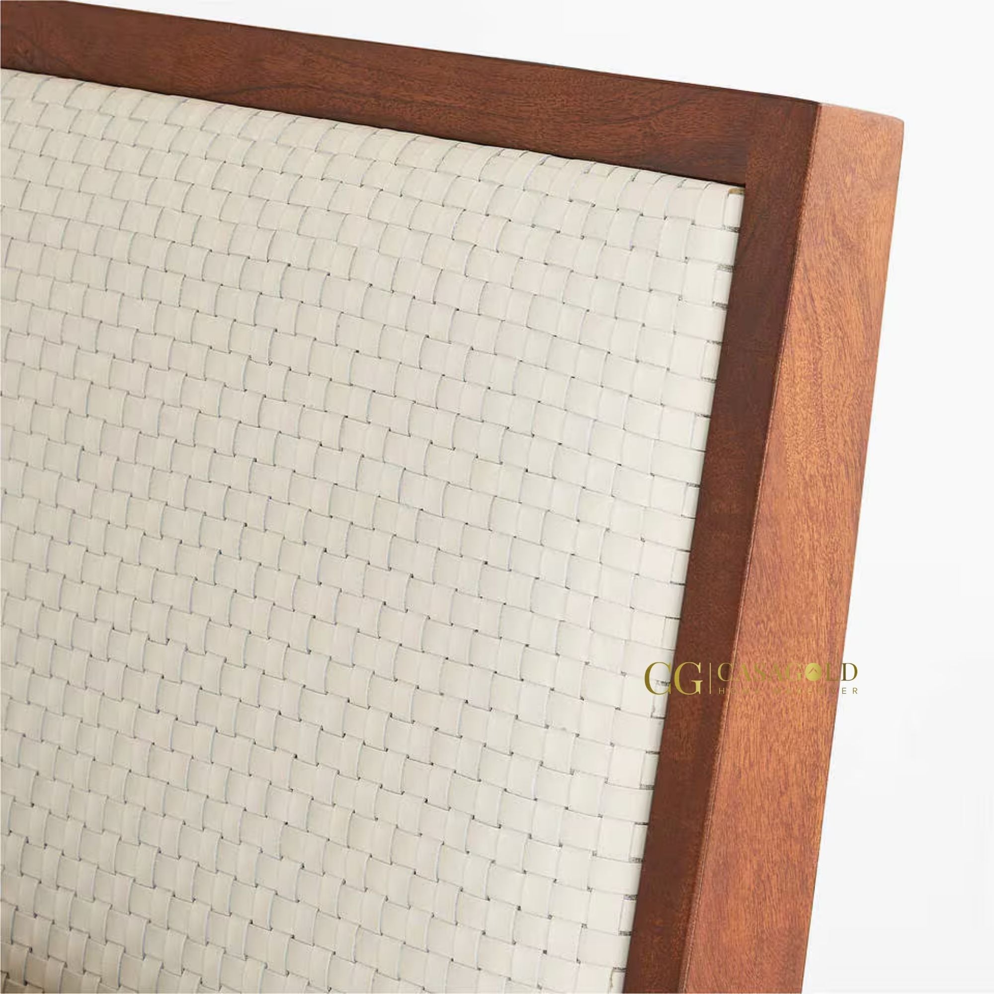 Minimalist acacia bed with a woven cane headboard.