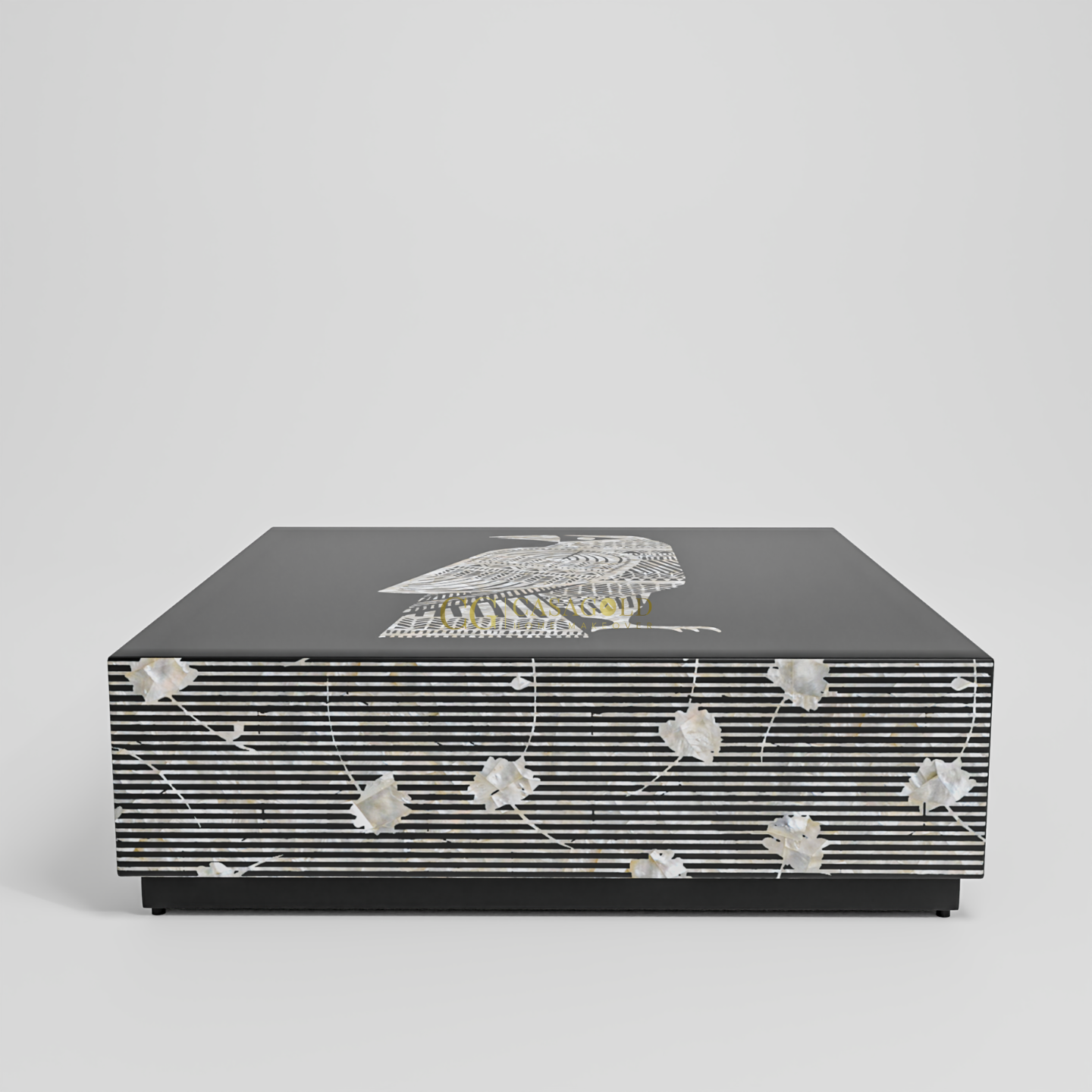 Unique coffee table with black surface and detailed bird illustration in white, gold, and textured accents.