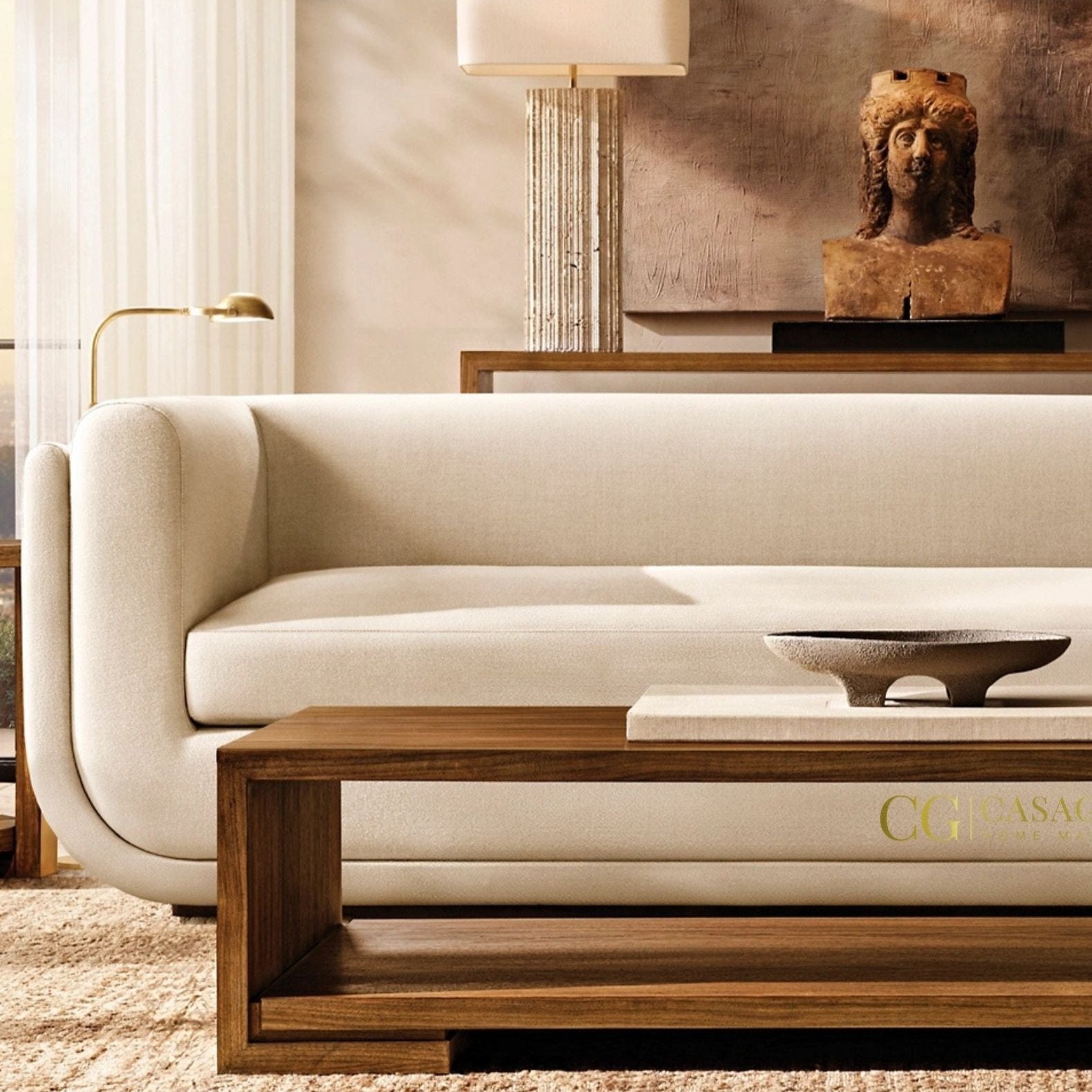 "Curved velvet sofa featuring brass legs and a contemporary style"