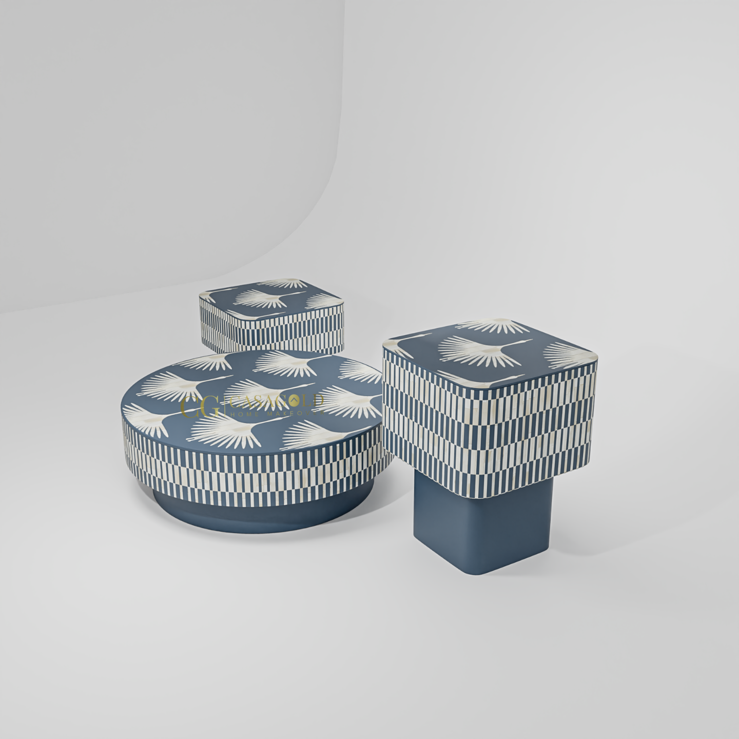 A three-piece set of decorative tables or ottomans. The round centerpiece has a pattern of fanned wings, while the two cubic side tables have a black and white striped pattern.