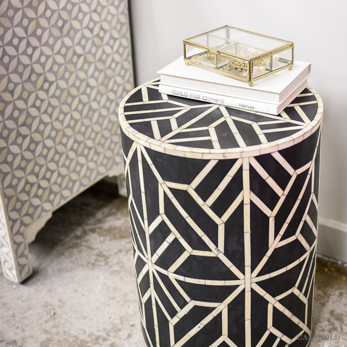 "Decorative drum inlay side table with a sturdy metal base"