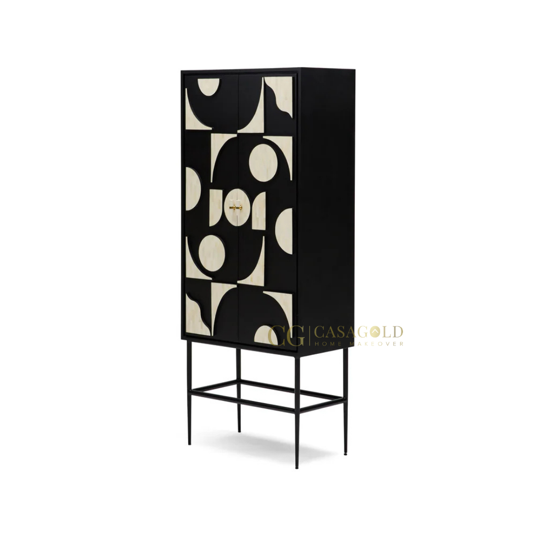 Geometric-patterned cabinet on slim legs placed against a neutral wall in a modern setting.