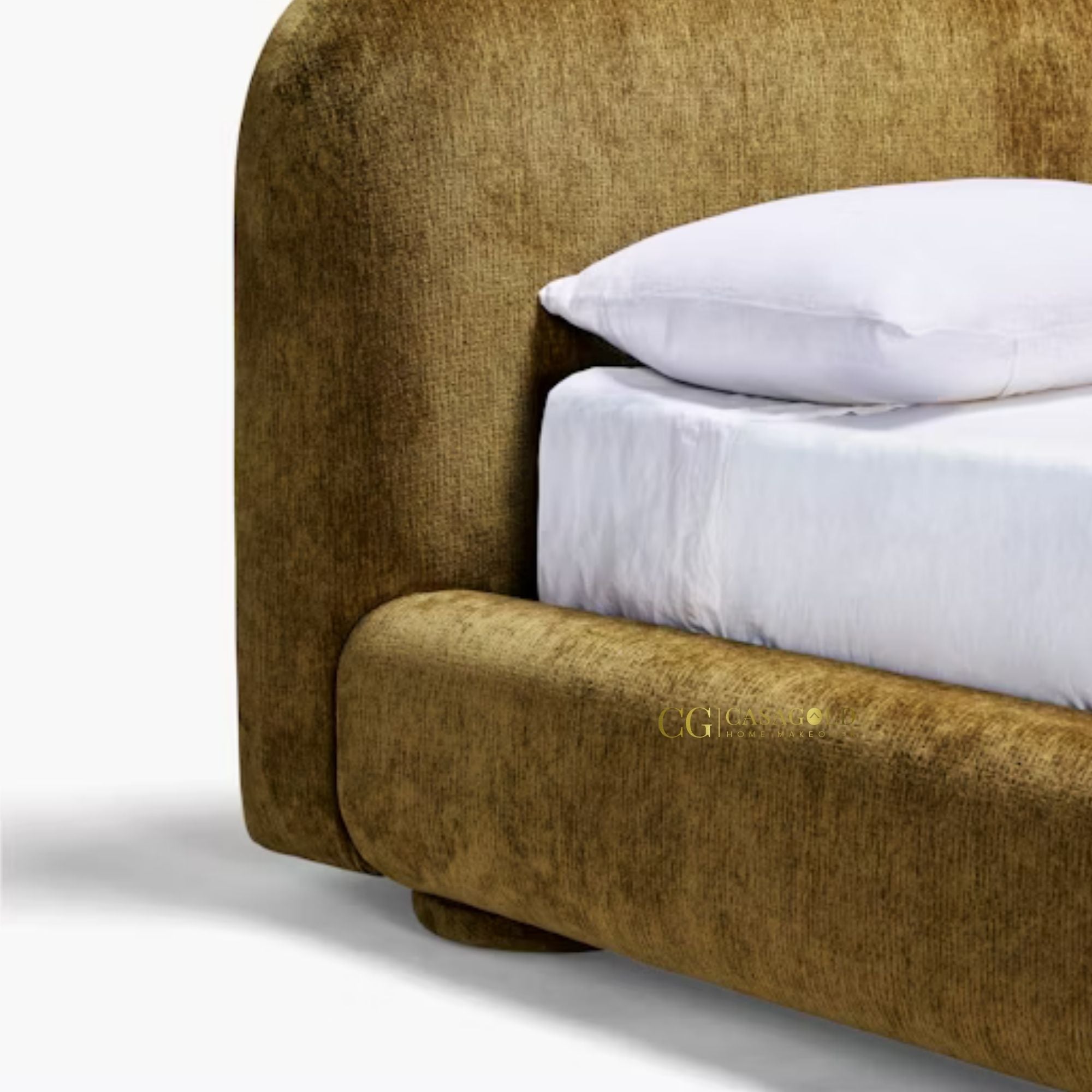 Luxurious golden velvet bed with curved headboard.