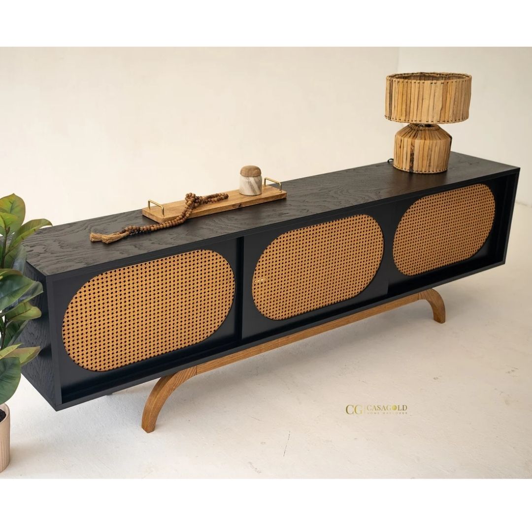 Natural rattan and black rubber wood TV stand with ample storage.