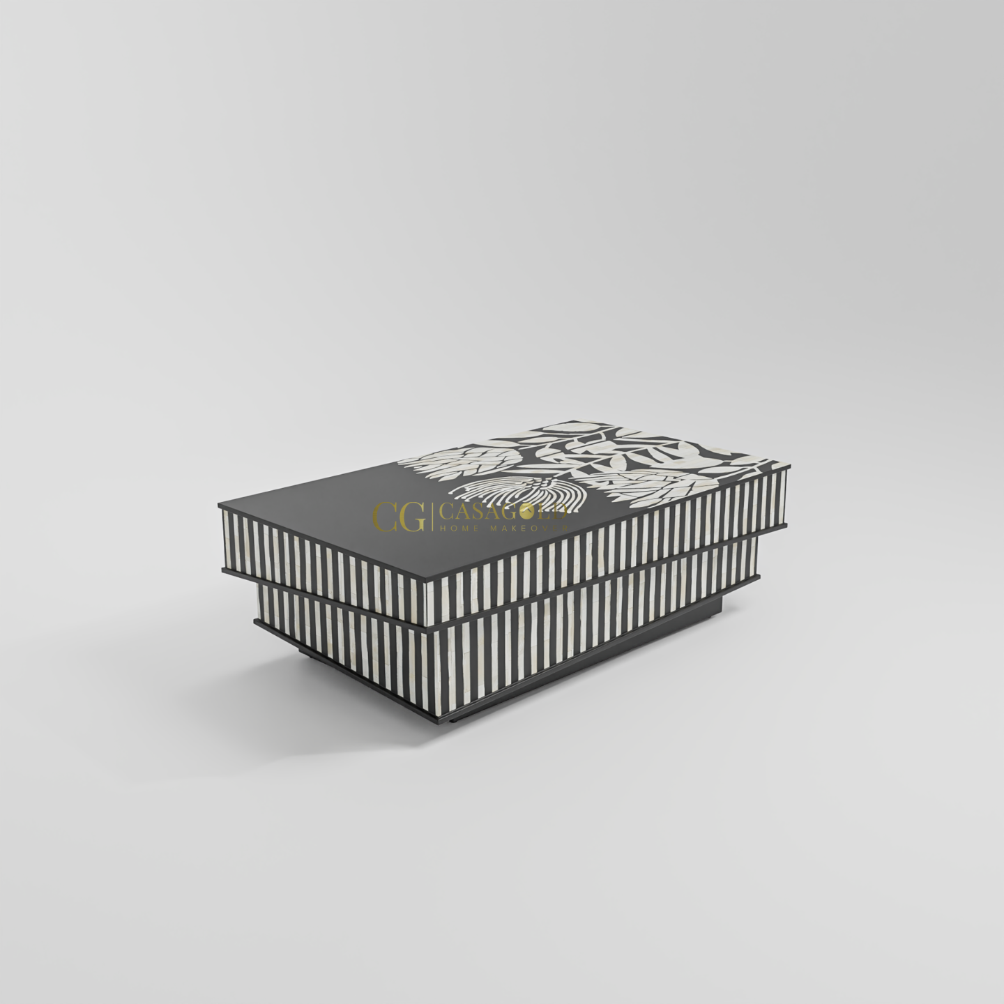 Artistic coffee table with bold black surface, abstract floral design, and layered striped sides.