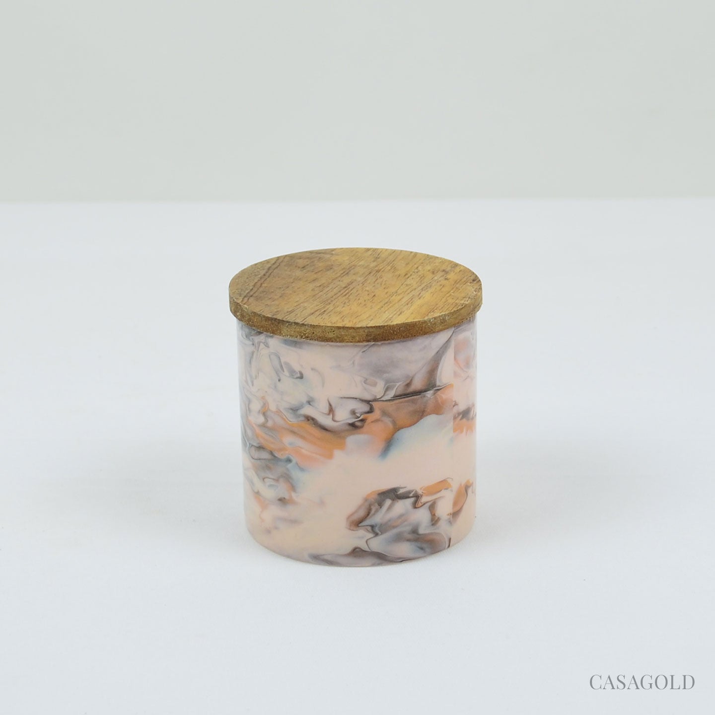 Natural beeswax candle on a bedside table
