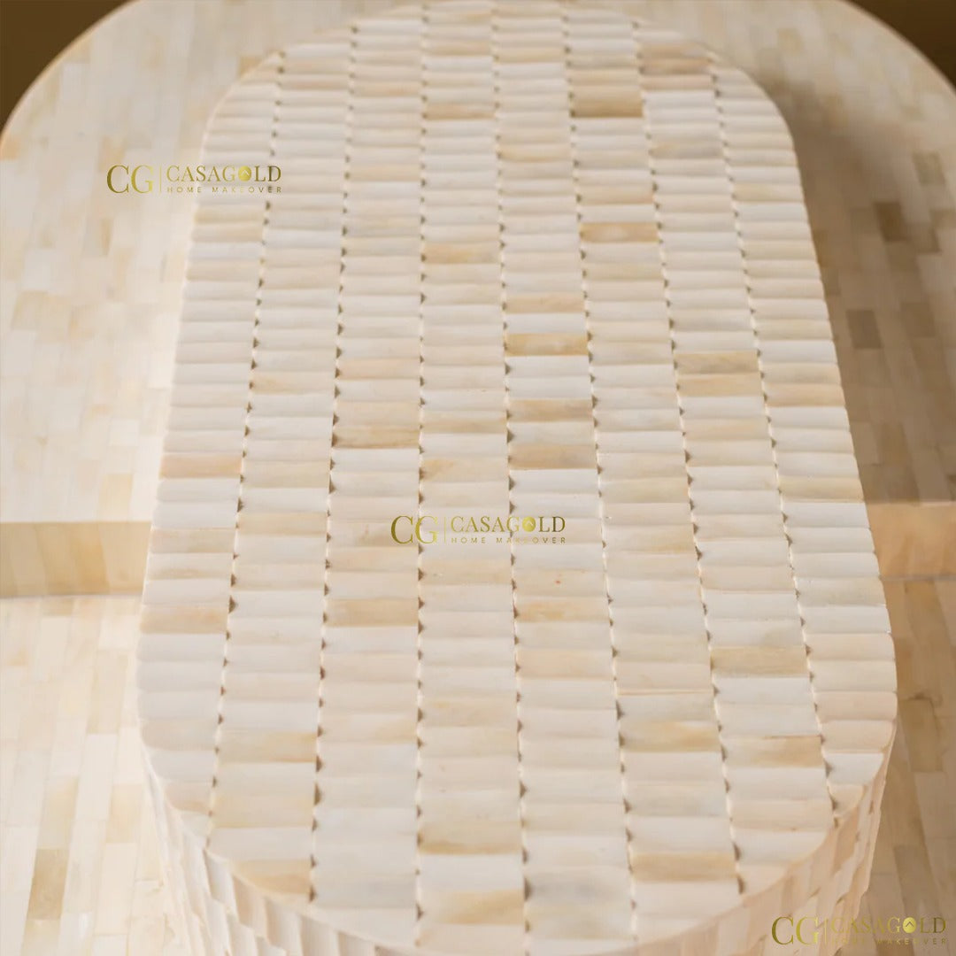 "Oval bone inlay coffee table in neutral tones"