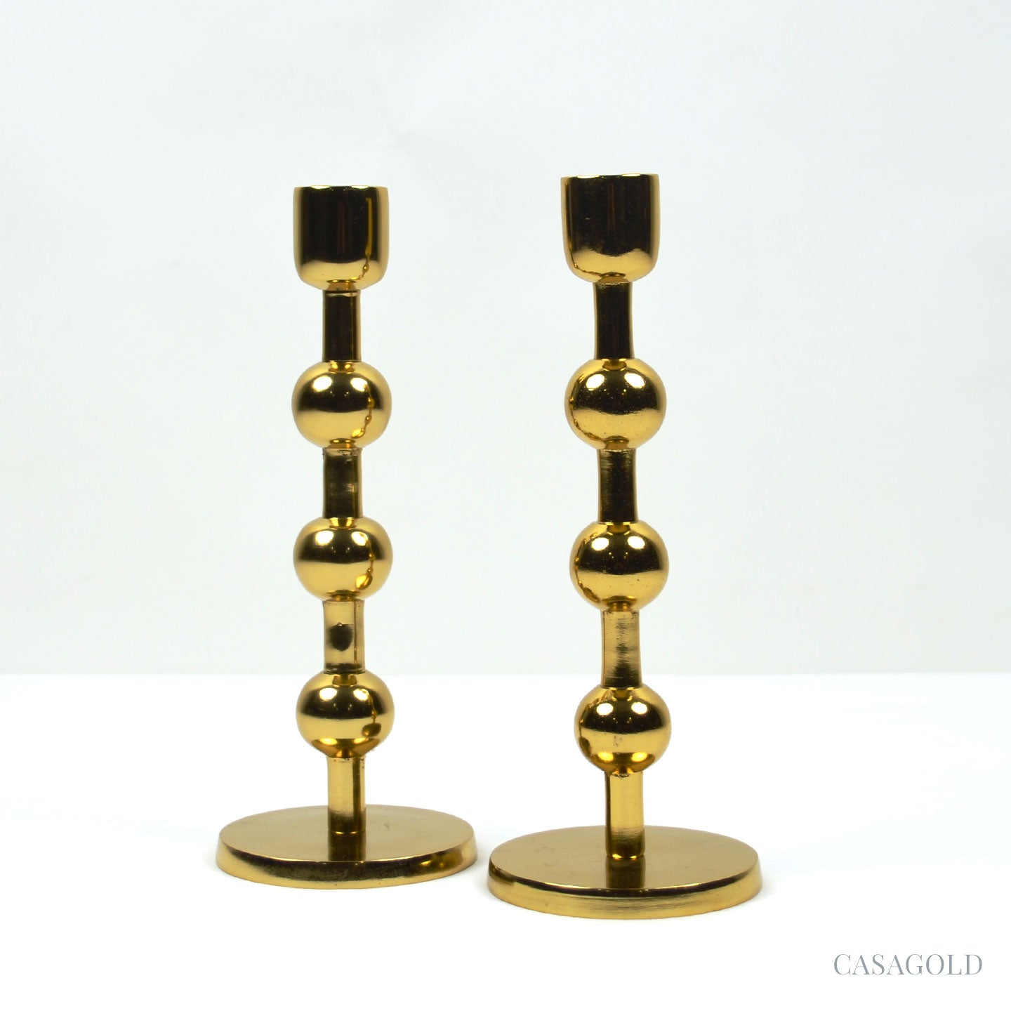 Polished brass holder with reflective shine