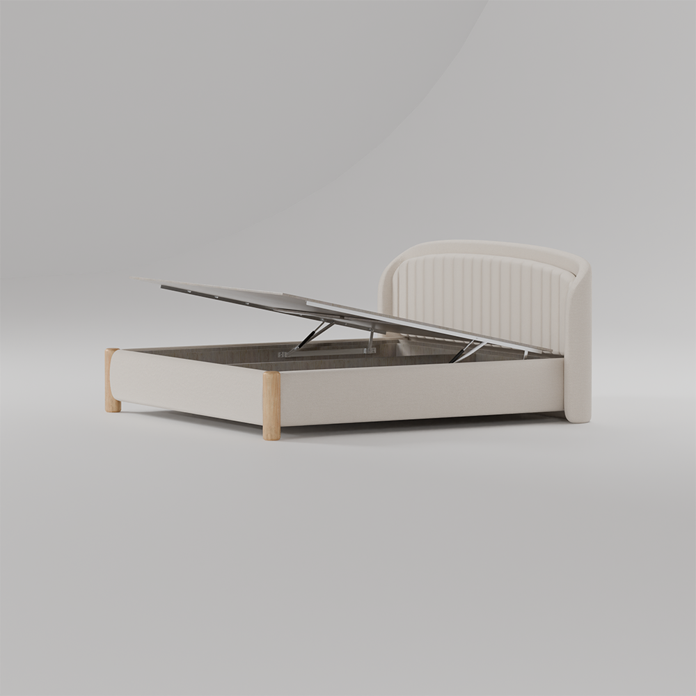 A modern lift-up storage bed frame in a warm off-white fabric with light natural wood legs, shown with the gas-lifted headboard open against a neutral gray studio background.
