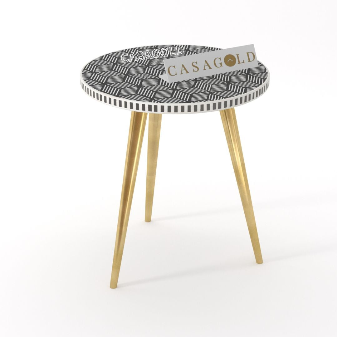 "Black and white round inlay side table featuring 3 elegant legs"