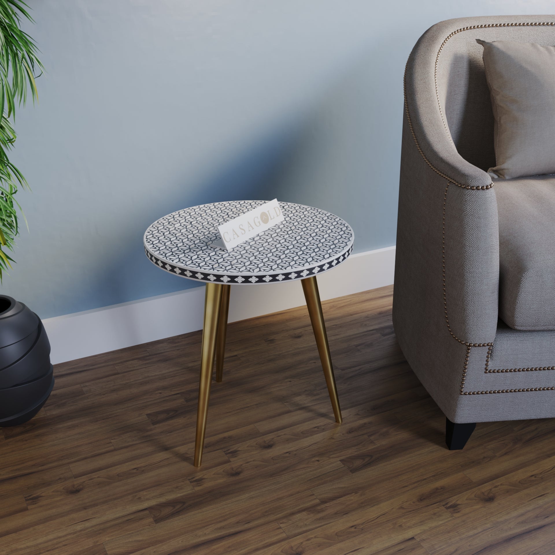 "Bone inlay round side table with gold finish and three elegant legs"