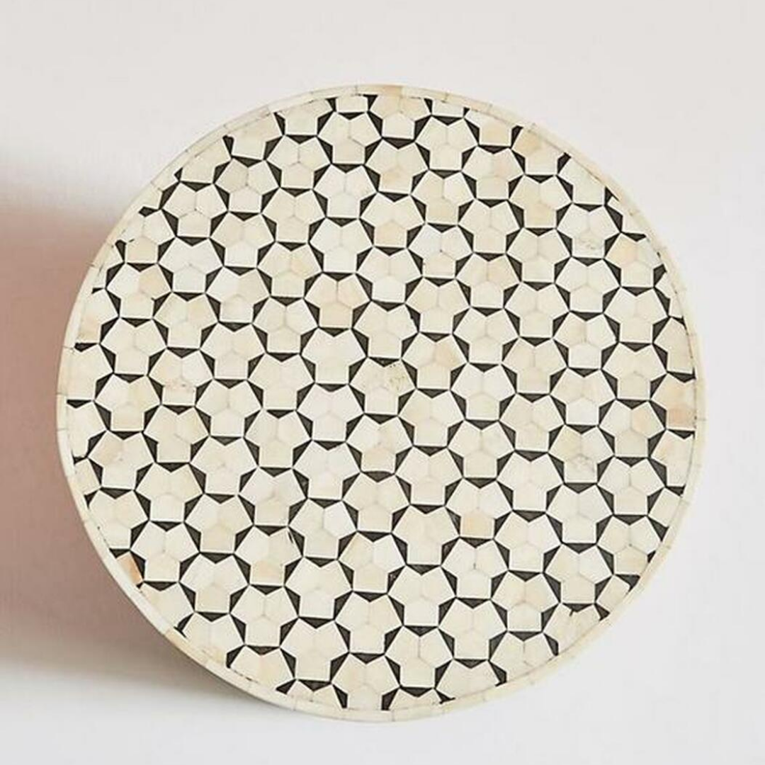 "Handcrafted drum inlay side table with unique bone patterns"