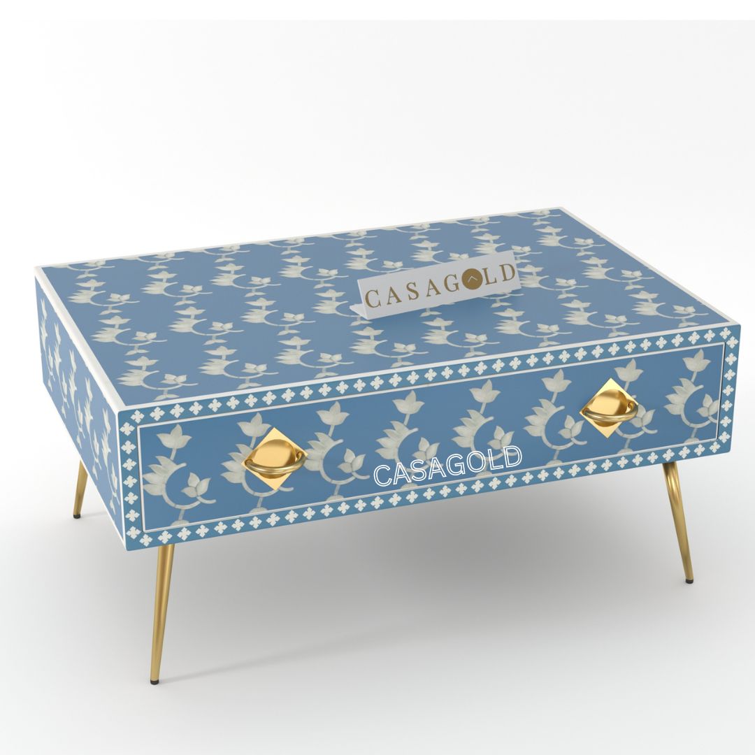 "Teal and white rectangular coffee table with bold bone inlay"