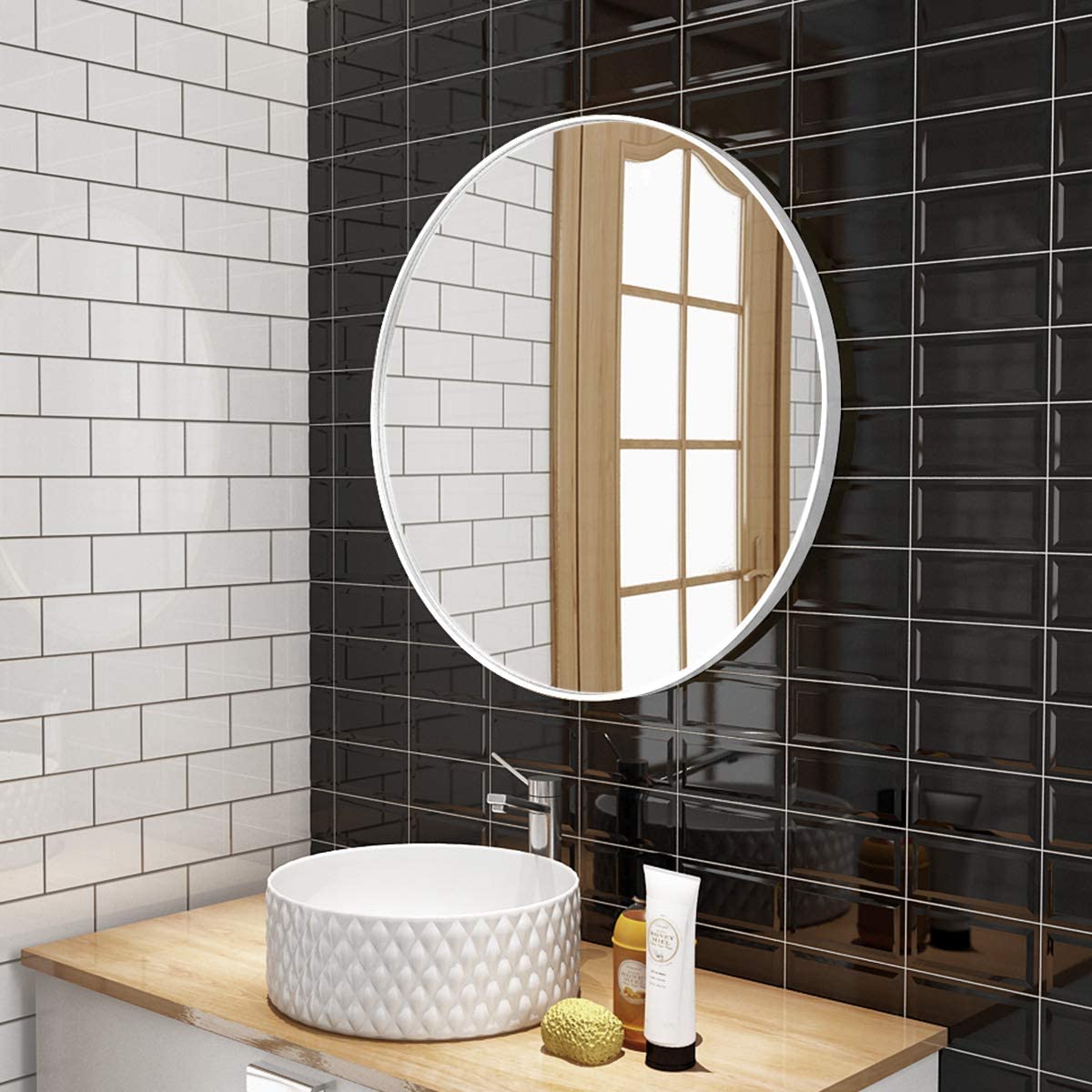 Round white glass mirror with metal frame decor