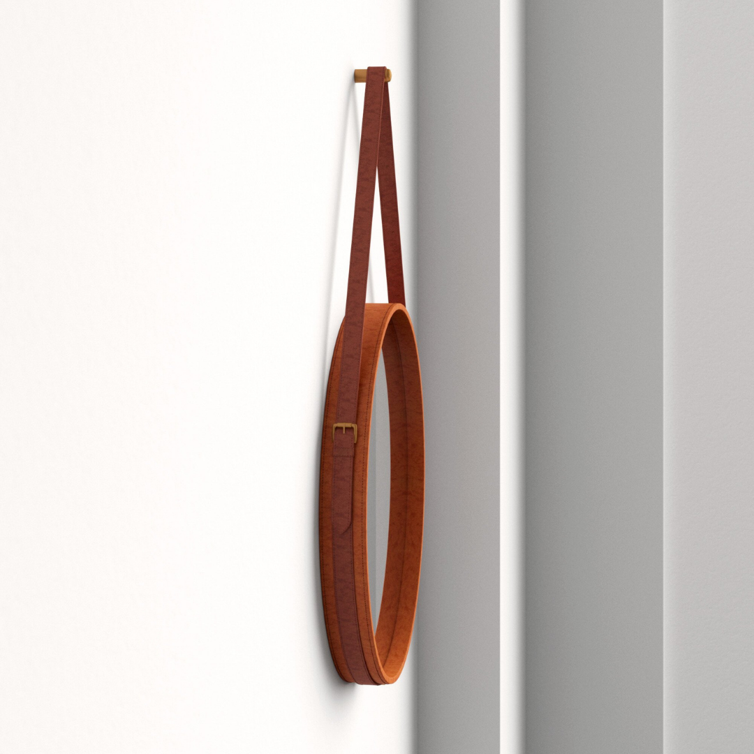 "Minimalist round mirror with a smooth leather edge, ideal for any room decor."