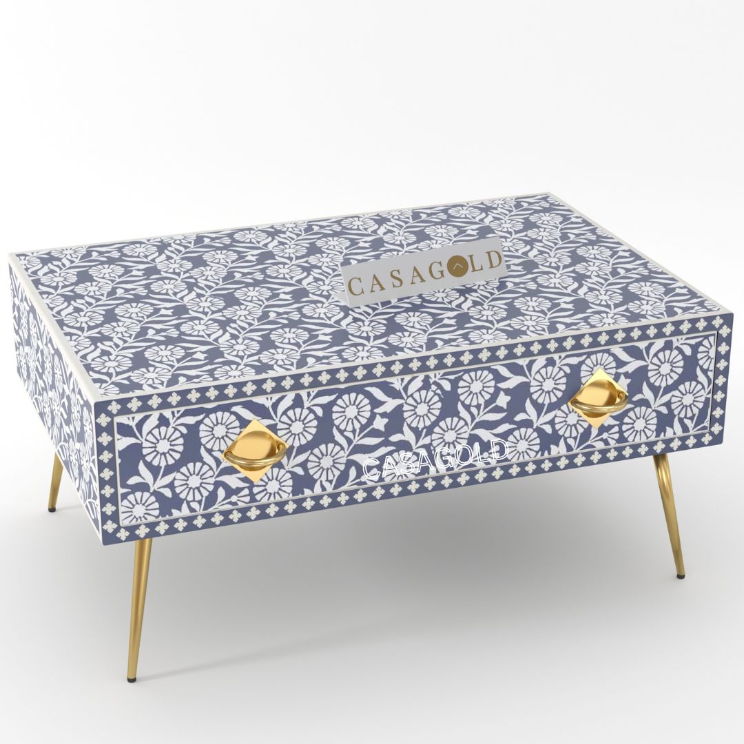 "Teal and white rectangular coffee table with bold bone inlay"