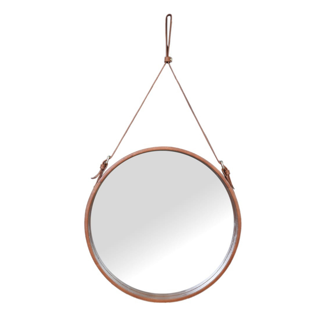 "Vintage brown leather vanity mirror with timeless charm for dressing areas."