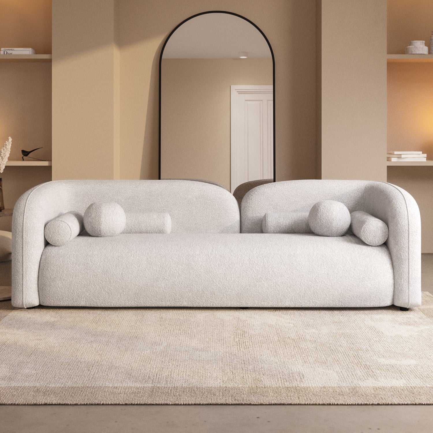 Three-seater modern sculptural bouclé sofa with rounded arms and matching bolster cushions, customisable to two-seater
