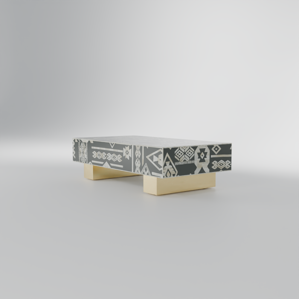 A rectangular coffee table with a dark gray and white geometric patterned top and light beige block legs, shown on a neutral gray studio background.