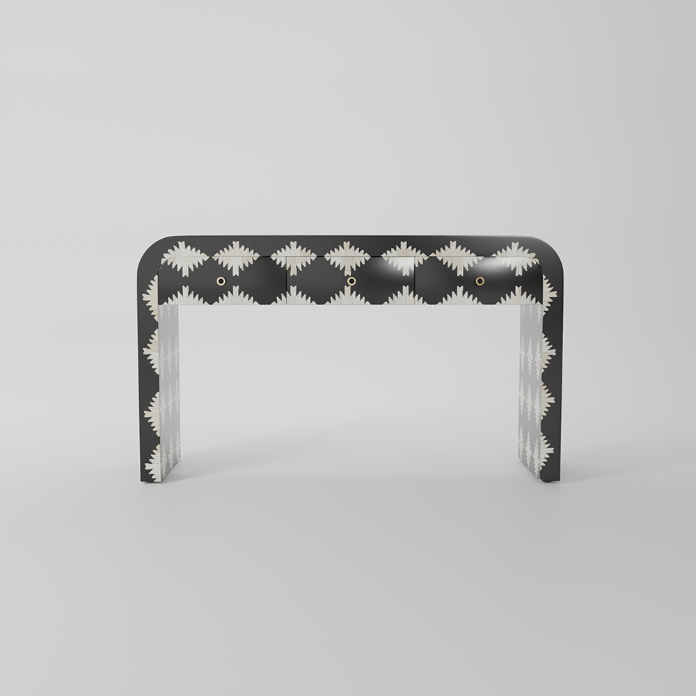 A modern U-shaped console table with a black lacquered finish and a white geometric pattern of repeating starburst or sunburst motifs, set against a neutral light gray background.