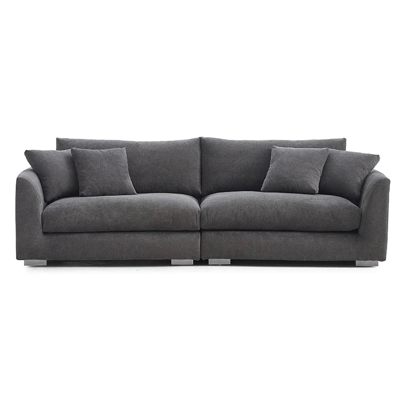 Contemporary dark grey three-seater sofa with deep seating, low-profile arms, and modern style.