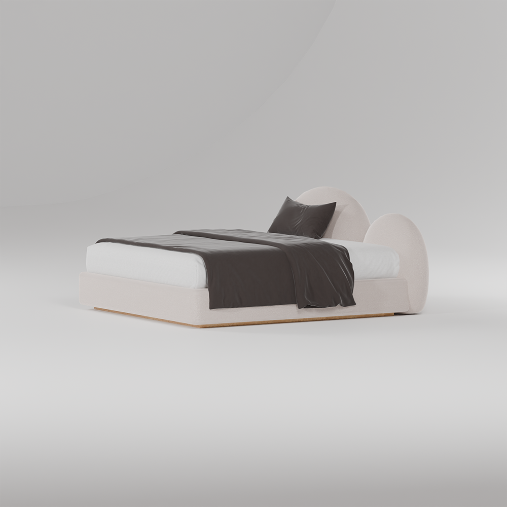 Cloud upholstered bed with sculptural rounded headboard in neutral fabric.