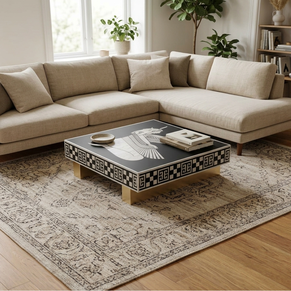 Discover The Isis Coffee Table by CasaGold, an Egyptian-inspired bone inlay table featuring a dramatic winged goddess motif and elegant gold base.