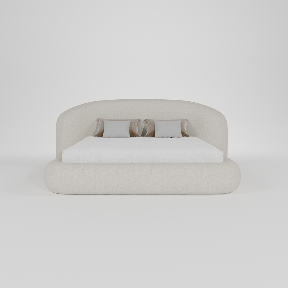 A modern low-profile platform bed with a rounded, upholstered headboard and footboard in a light beige fabric, styled with a white mattress and three neutral throw pillows against a seamless light gray background.
