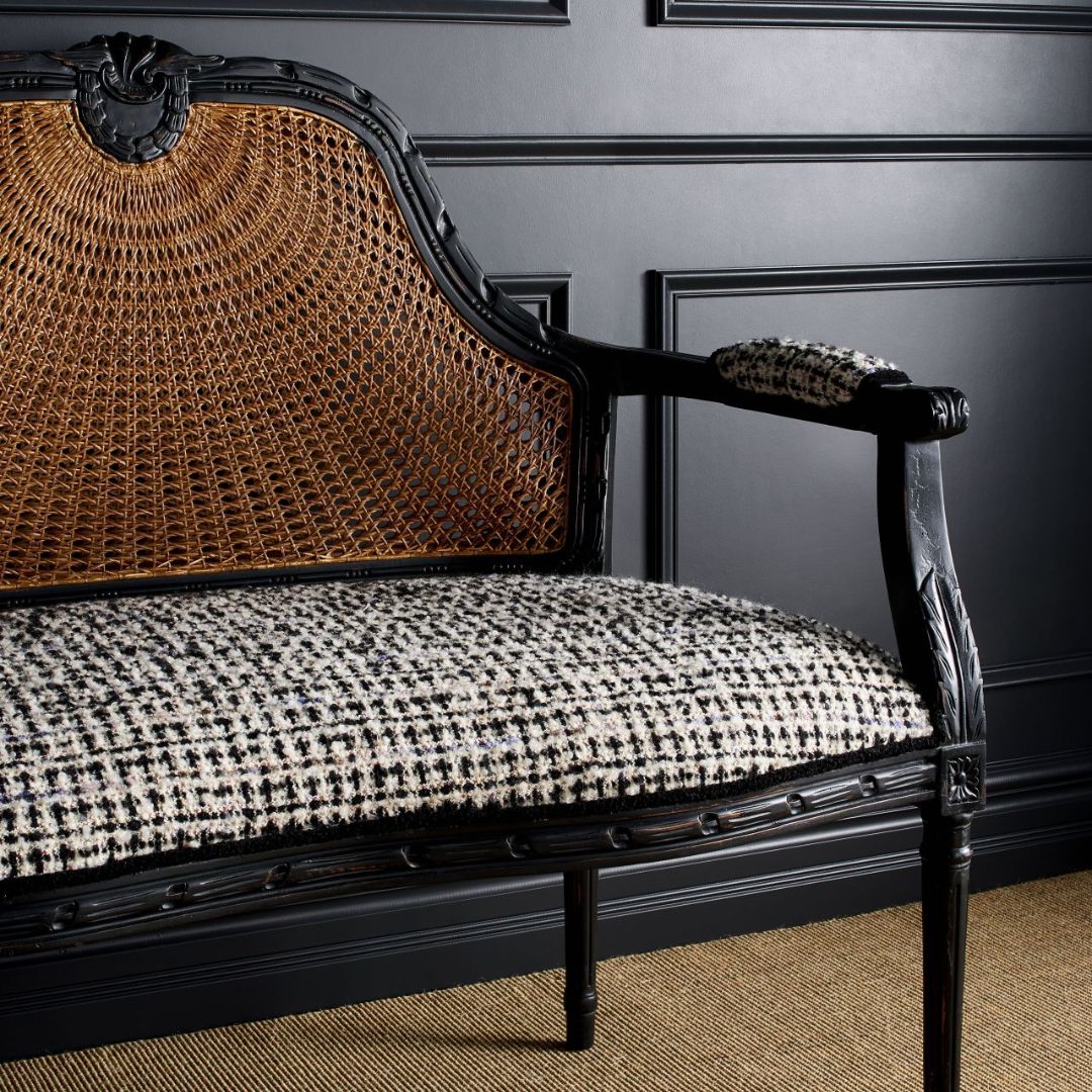Elegant handwoven rattan luxury sofa with plush cushions

