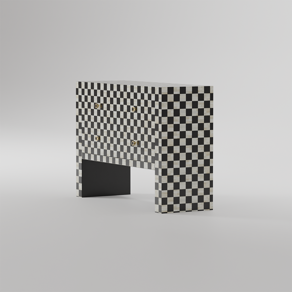 A modern console table with a black and white checkerboard pattern on the upper body and legs, featuring a solid black lower panel and small gold hardware, set against a neutral gray background.