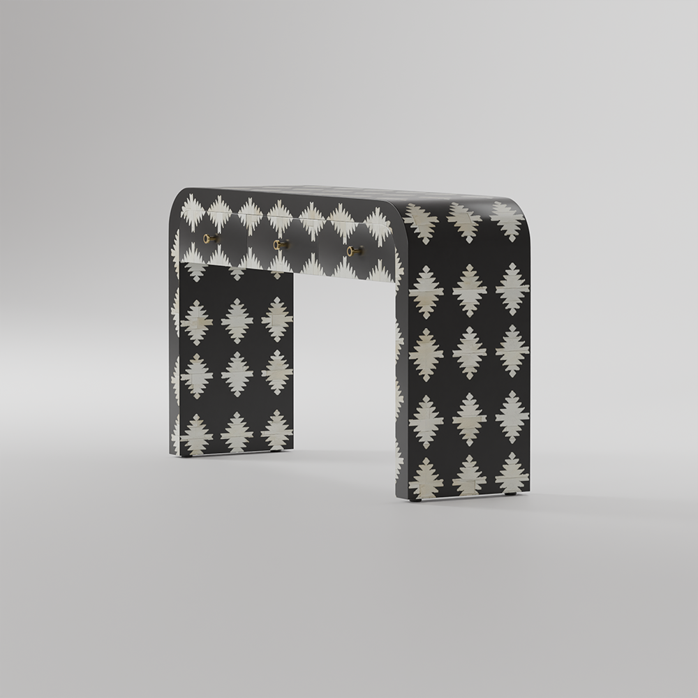 A modern U-shaped console table with a black and white ikat pattern, shown on a neutral gray studio background.