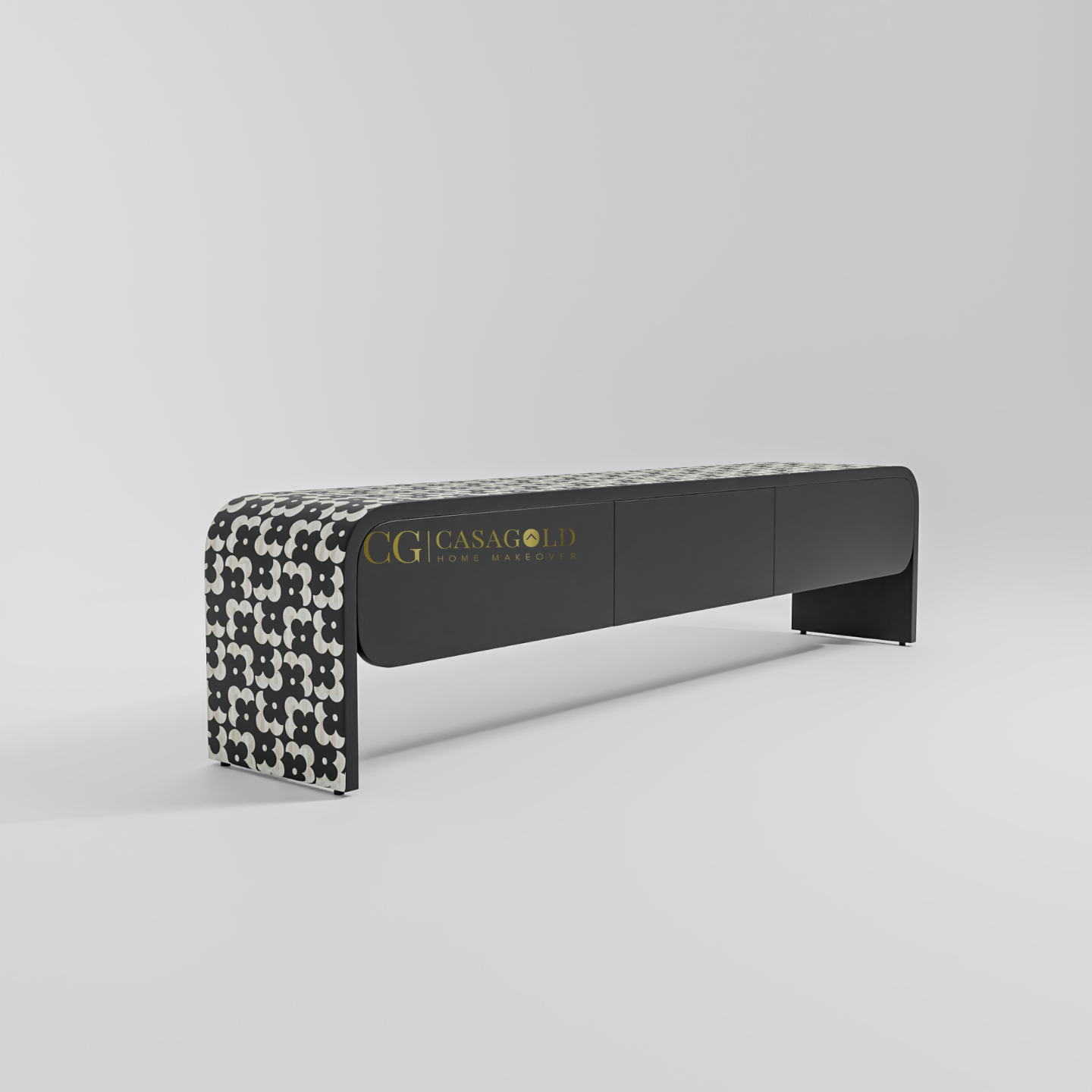 A minimalist black and white credenza featuring a repeating floral or quatrefoil pattern across the front.