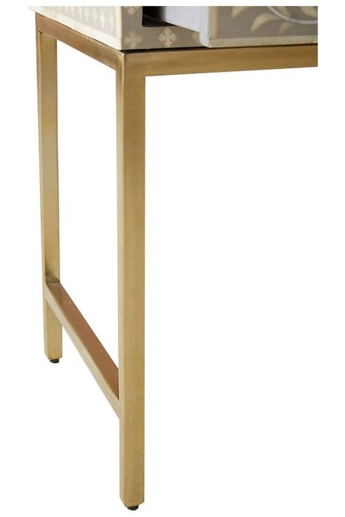 "Modern rectangular bone inlay bedside table supported by a sleek gold frame"
