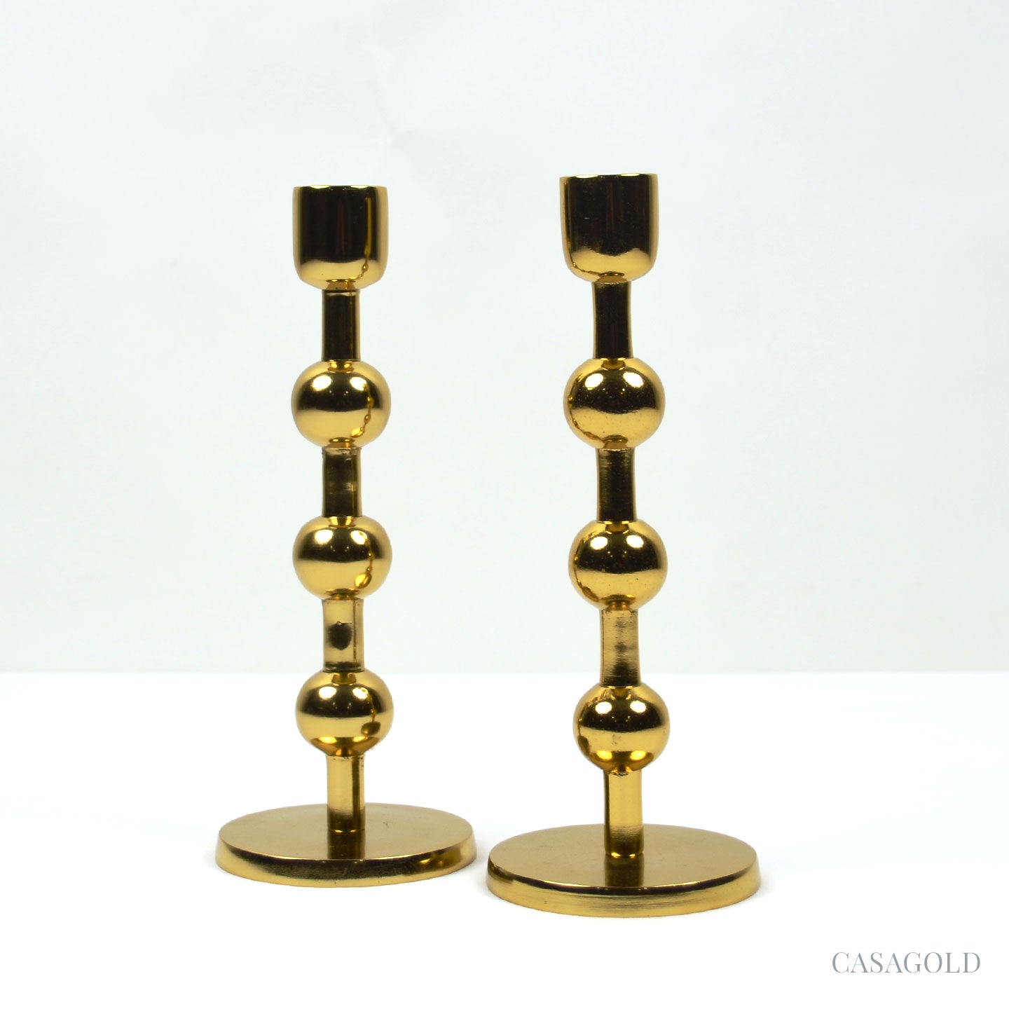 Polished brass holder with reflective shine
