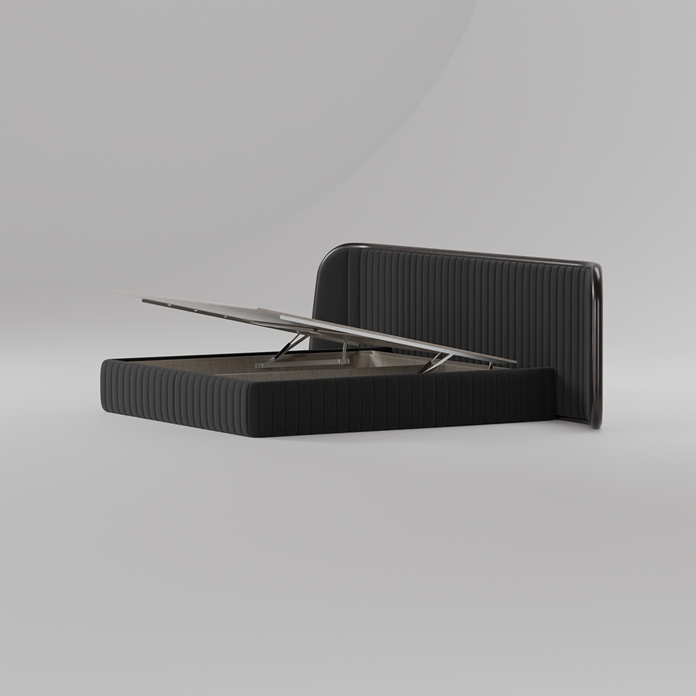A modern black ribbed storage bench or desk with a hinged lid that is open, showing a silver laptop resting on its support mechanism, set against a clean light gray studio background.