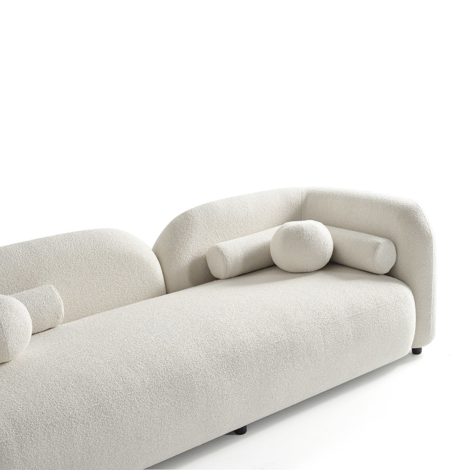 Minimalist cream bouclé sofa with rounded design, bolster cushions, and option for two-seater customisation