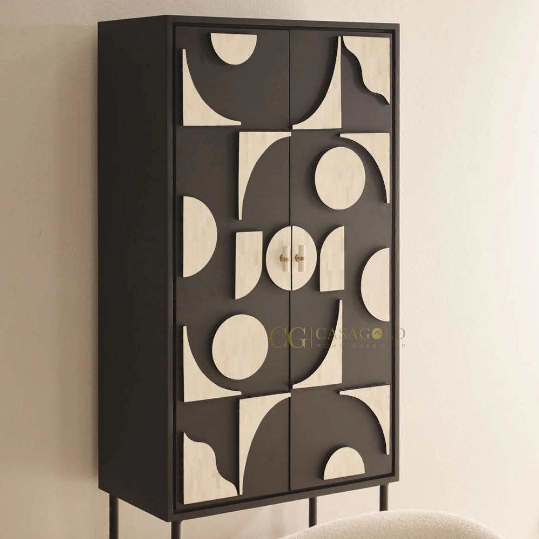 Modern vertical storage unit with artistic black and beige door design standing in a minimalist room.

