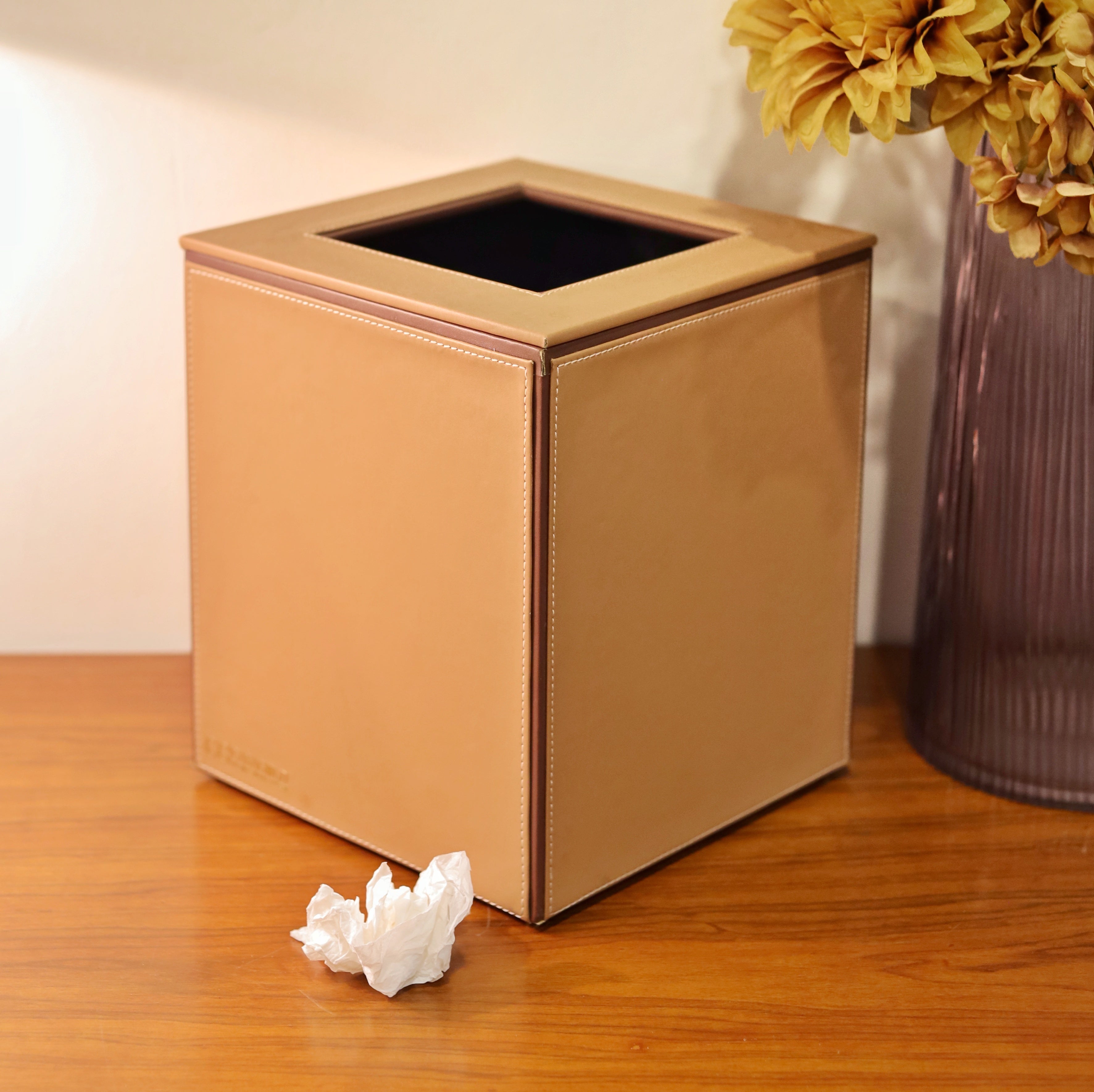 Tan dustbin in a luxurious bathroom