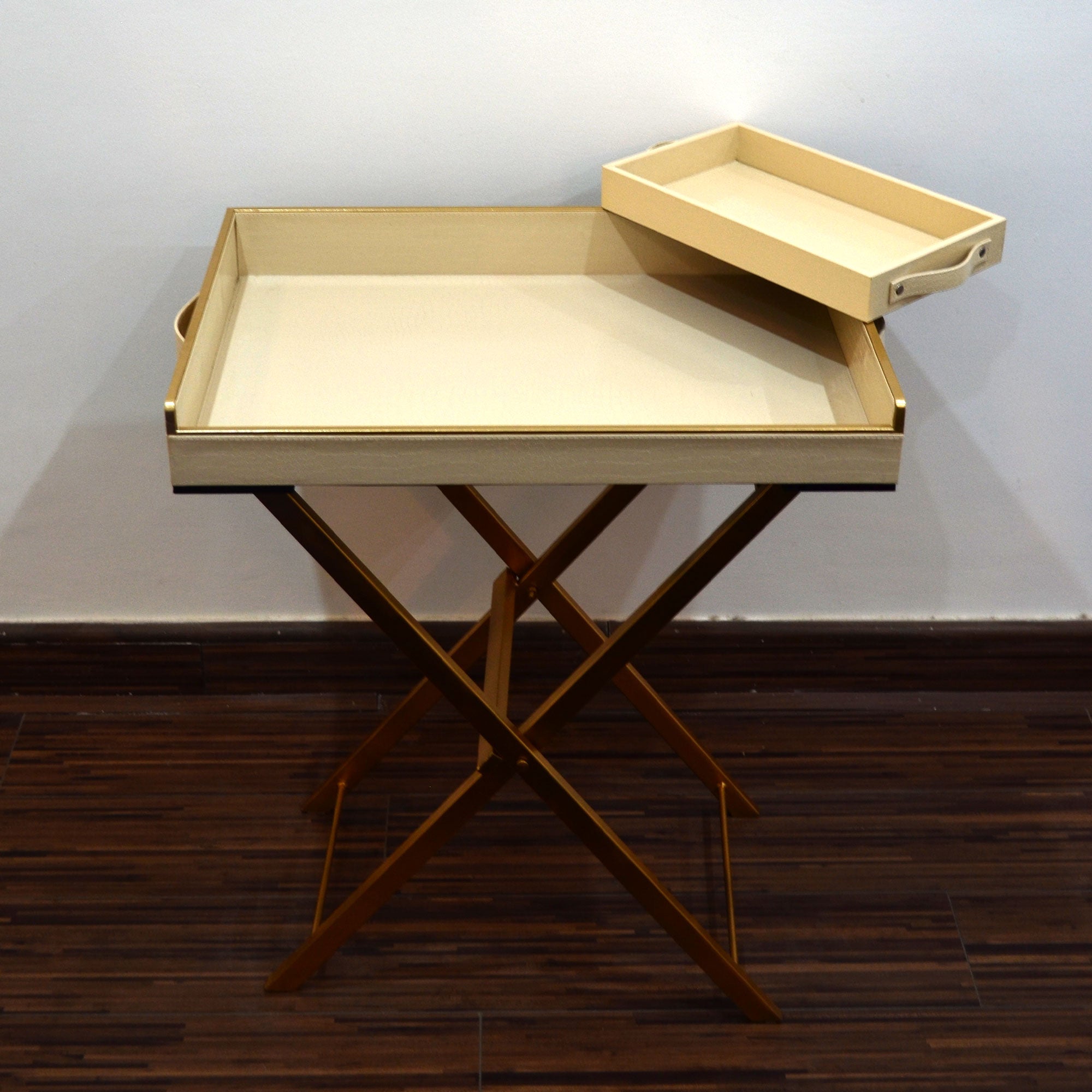 Wooden butler tray with folding stand for easy serving.

