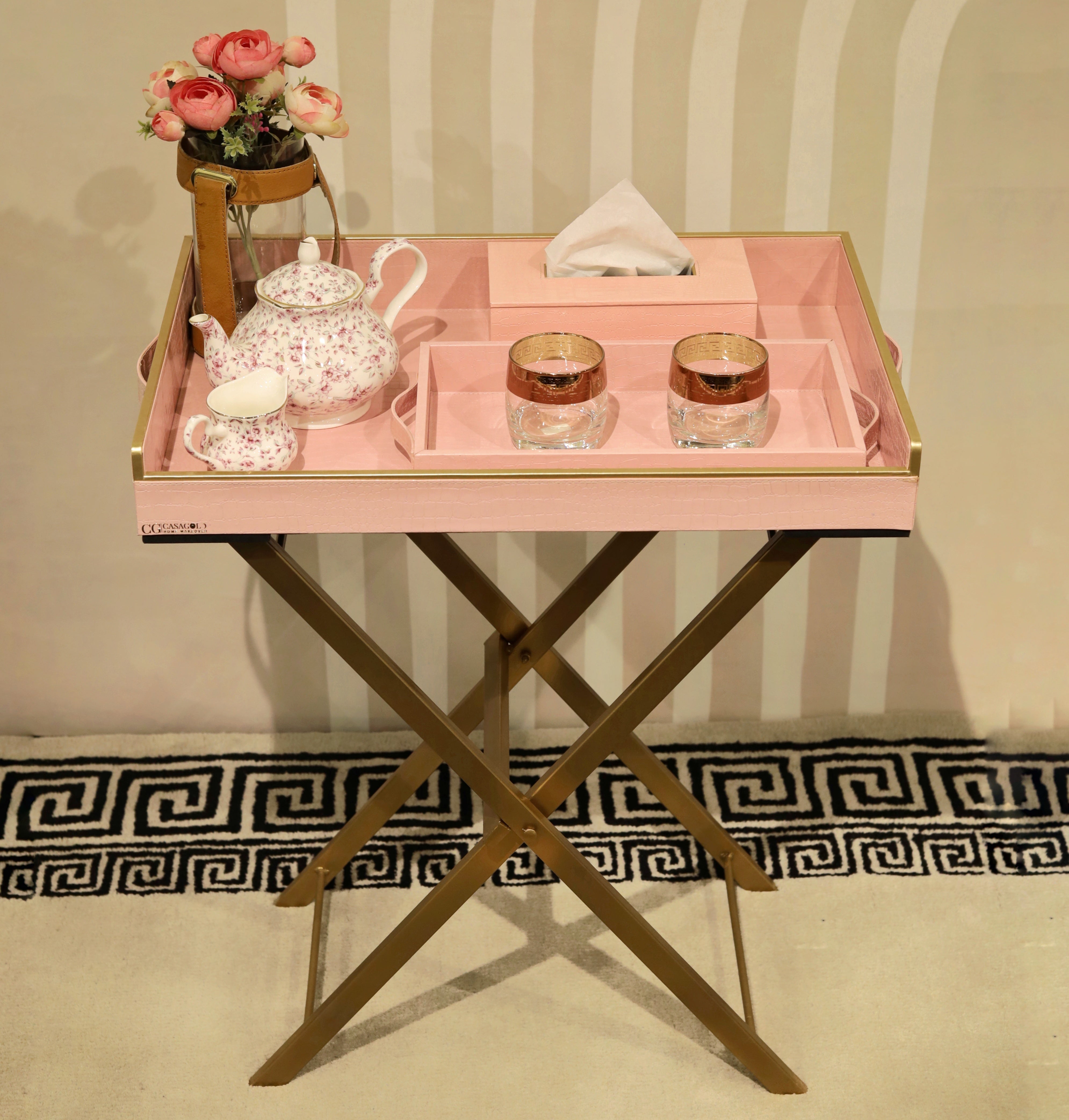 Wooden butler tray with folding stand for easy serving.