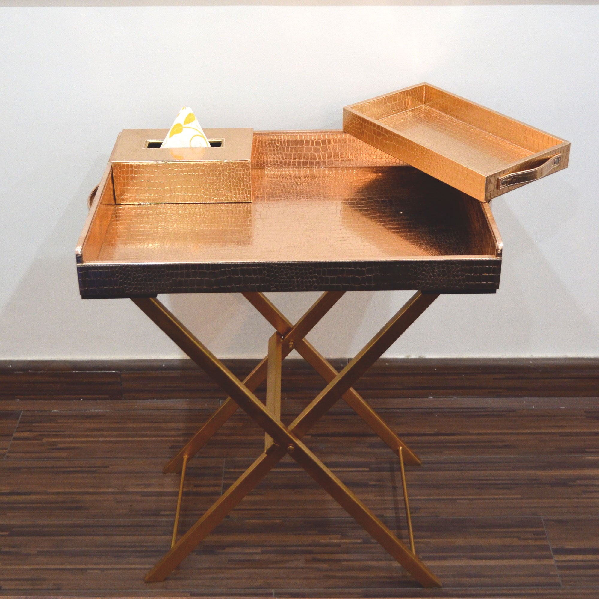 Wooden butler tray with folding stand for easy serving.