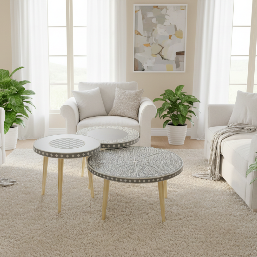 Living room with white sofa, decorative tables, and plants
