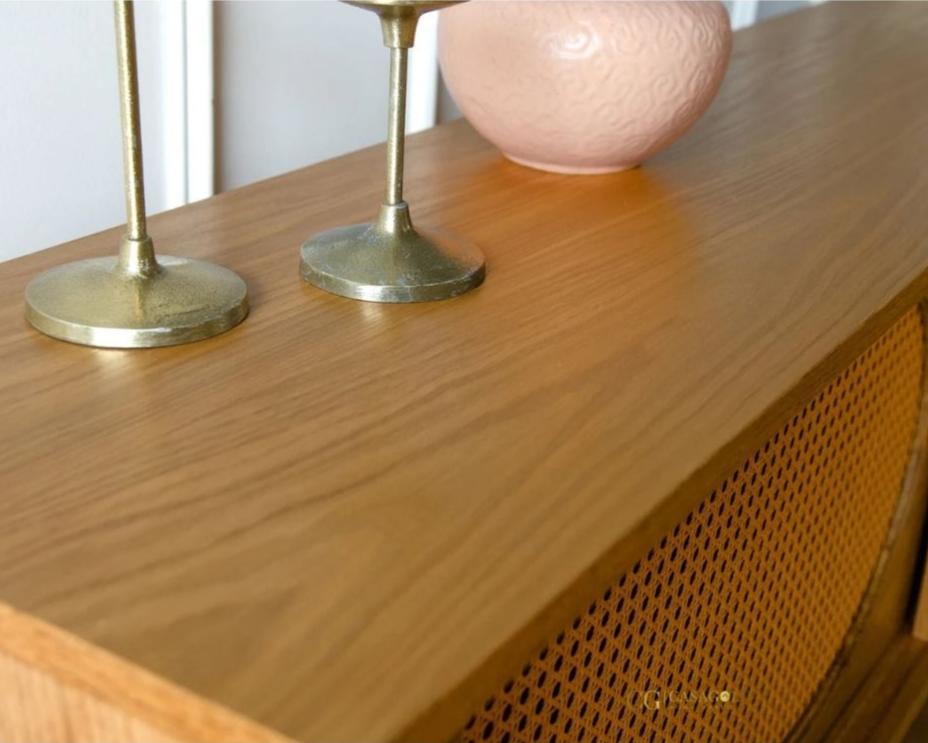 Handcrafted wooden TV console in Golden Oak with customisable design and elegant cane doors