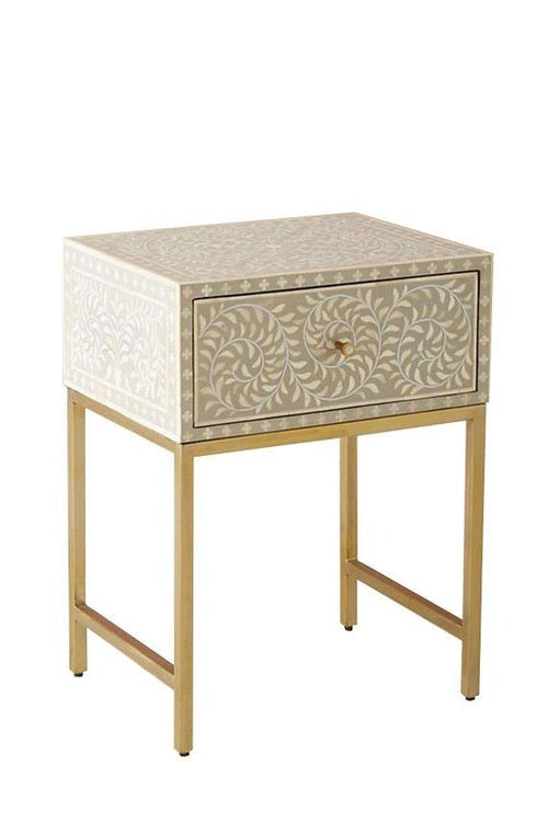 style rectangular bedside table with intricate inlay and gold legs"
