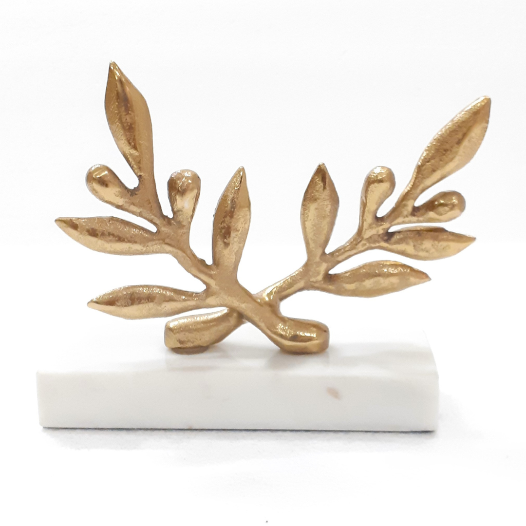 Antique brass leaf figurine on a mantle